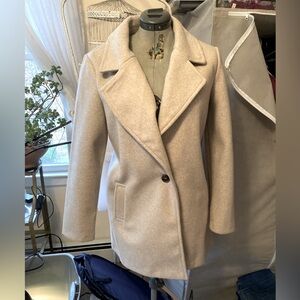 Cream/beige overcoat winter coat.